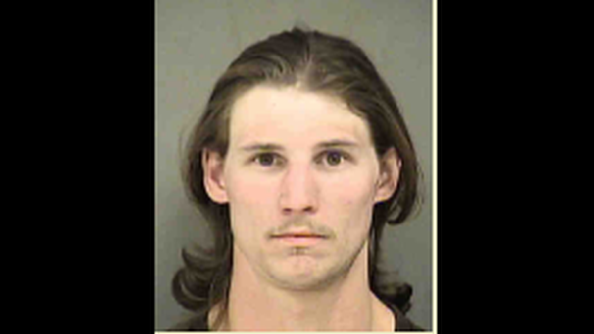 Jason Donald Wayne, 28, is charged with communicating threats and ethnic intimidation after he allegedly threatened an African-American poll volunteer, according to Mecklenburg County jail records. Wayne made his first court appearance on Friday.