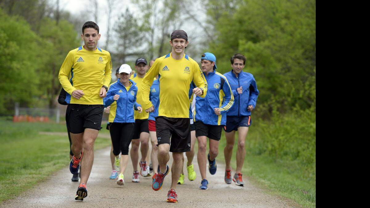 
Caleb Boyd, left front, and Billy Shue, right front, and other members of the Charlotte Running Club take a light run on the McAlpine Greenway. Shue was the top Boston Marathon finisher from Charlotte on Monday.

