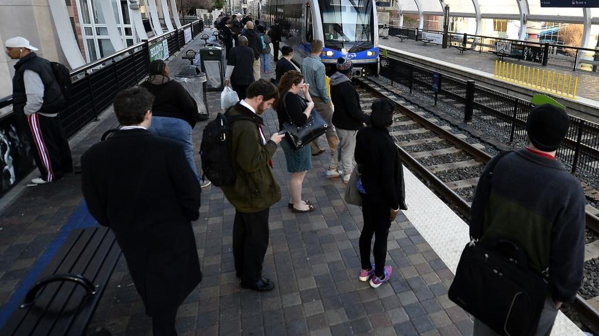 Commuters wait at the CTC/Arena Station to ride the Lynx Blue Line light rail on Wednesday, January 21, 2015.
