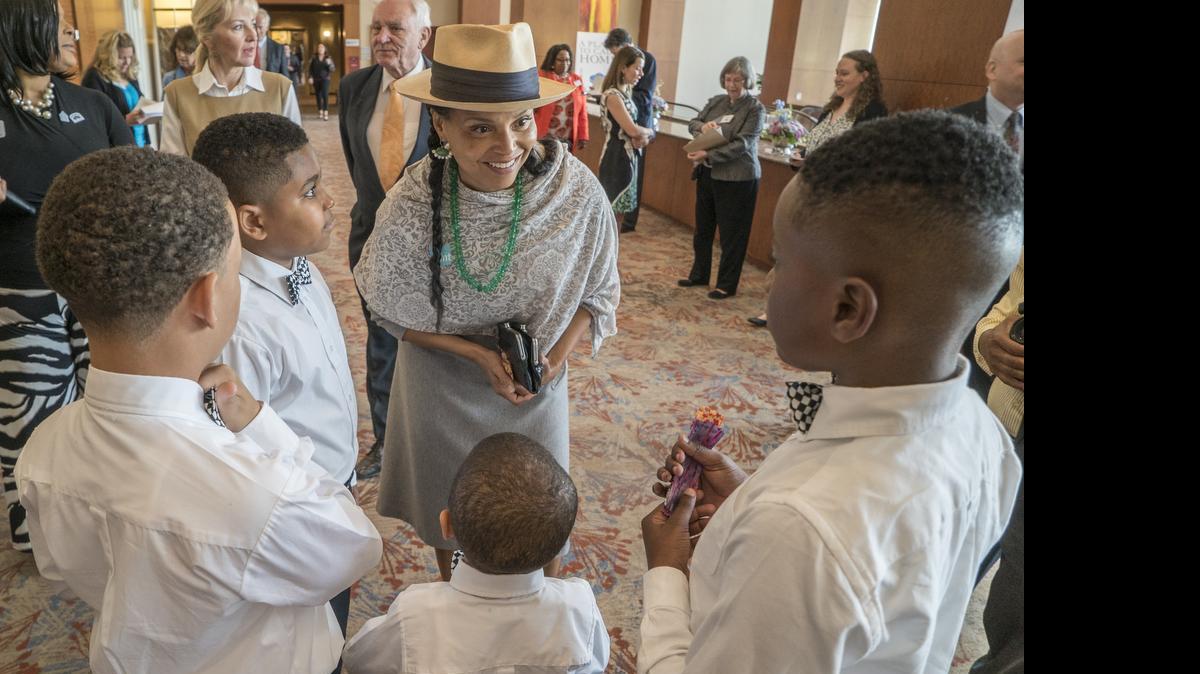 
Actress Victoria Rowell talks to members of the Youth Football Club of Mint Hill, who greeted guests, before entering the luncheon. From left, clockwise, are Alexander Edwards, Jayden White, Rowell, Shomari White and Maximus White. Rowell was the keynote speaker for the Childrens Home Society of North Carolina at a luncheon on 04.30.15 at the Westin hotel in uptown Charlotte.
