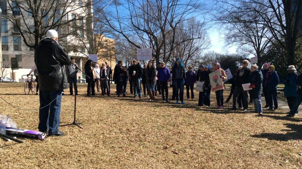 Jibril Hough, spokesman for the Islamic Center of Charlotte, speaks to the crowd at Marshall Park on Saturday protesting President Donald Trump’s immigration order and other polices.