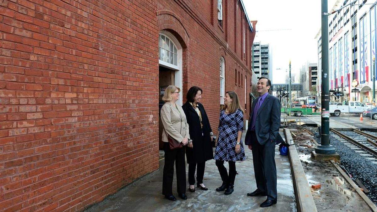 Charlotte Museum of History and Historic Charlotte officials visit the century-old Dixie’s Tavern building (soon to be Google Fiber’s office), which they say is an example of adaptive reuse of old buildings. The museum and Historic Charlotte announced they are merging to expand their impact. From left, Kay Peninger, Diane Althouse, Jodie Lawson and Paul Kurzeja..
