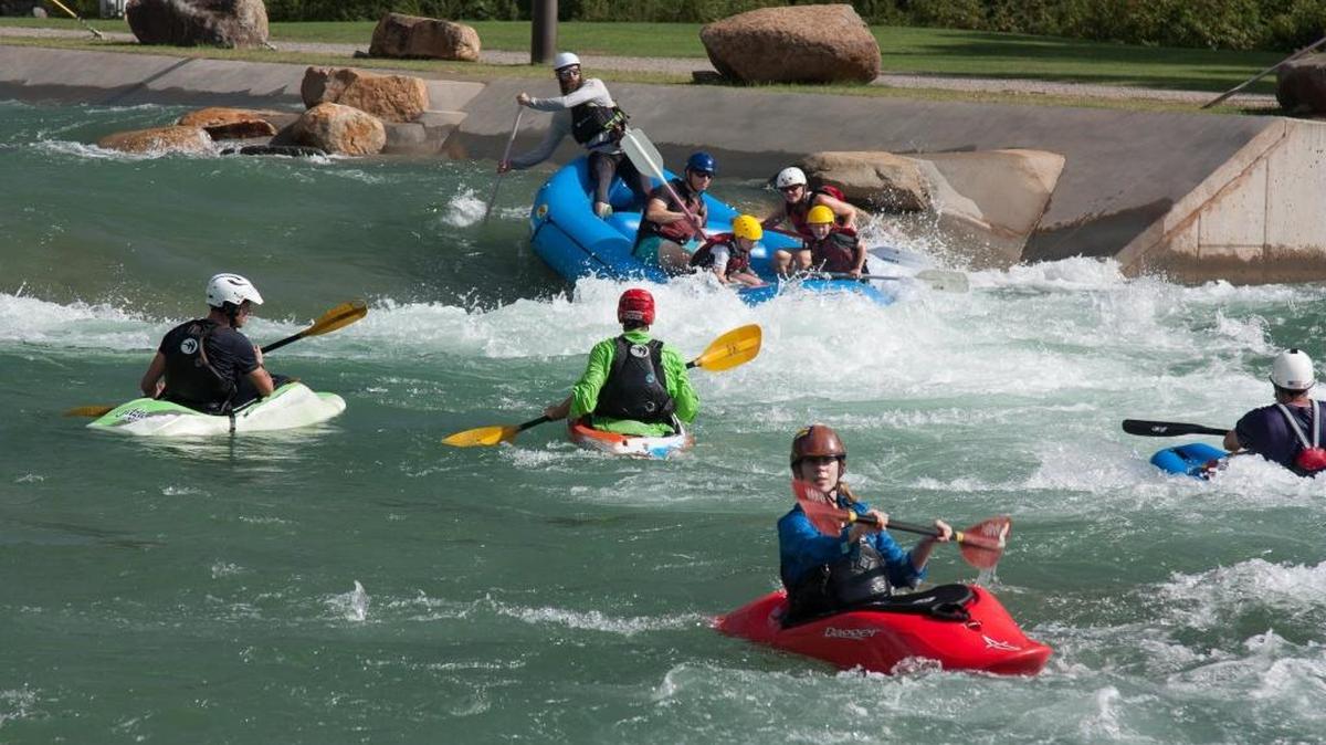 Paddlers return to the water Aug. 14, 2016, at the U.S. National Whitewater Center after re-opening the rafting channels.