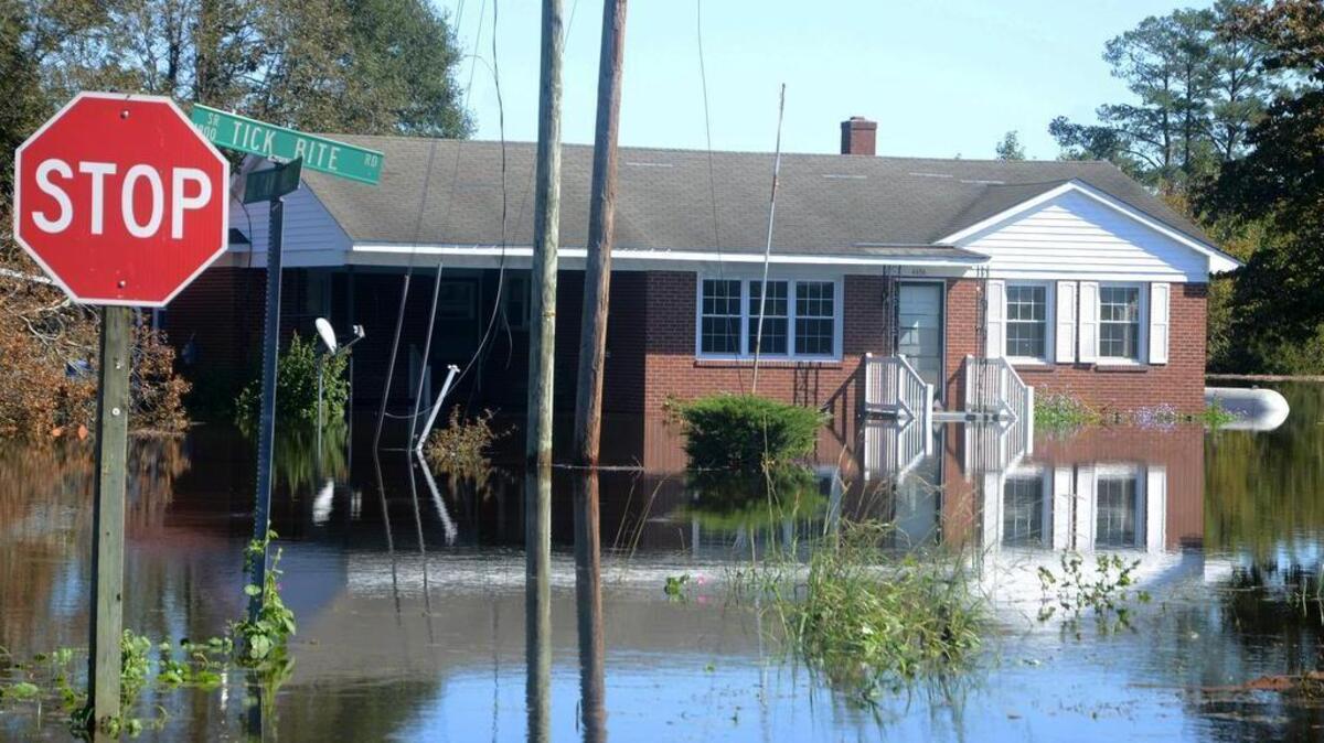 Flood waters cover Tick Bite Road and Saw Mill Road in the Grifton, Lenoir County community Thursday. Residents were evacuated by the National Guard.