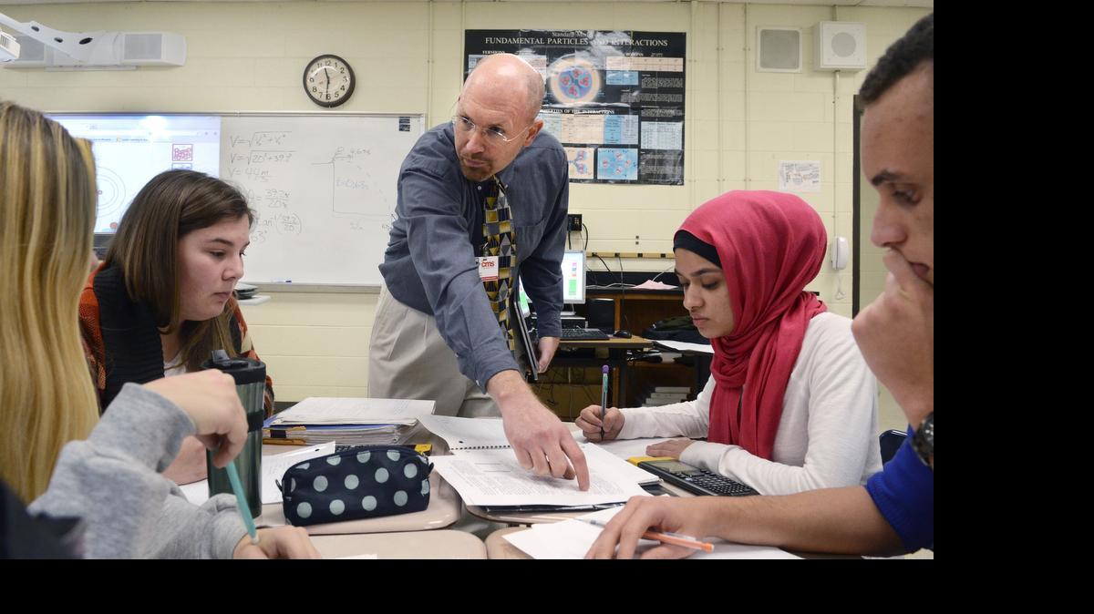 
CMS teachers, including Kevin Patterson of North Mecklenburg High (center), have been working with Davidson professors since 2013 to create online lessons on the toughest concepts in AP calculus, physics and macroeconomics.
