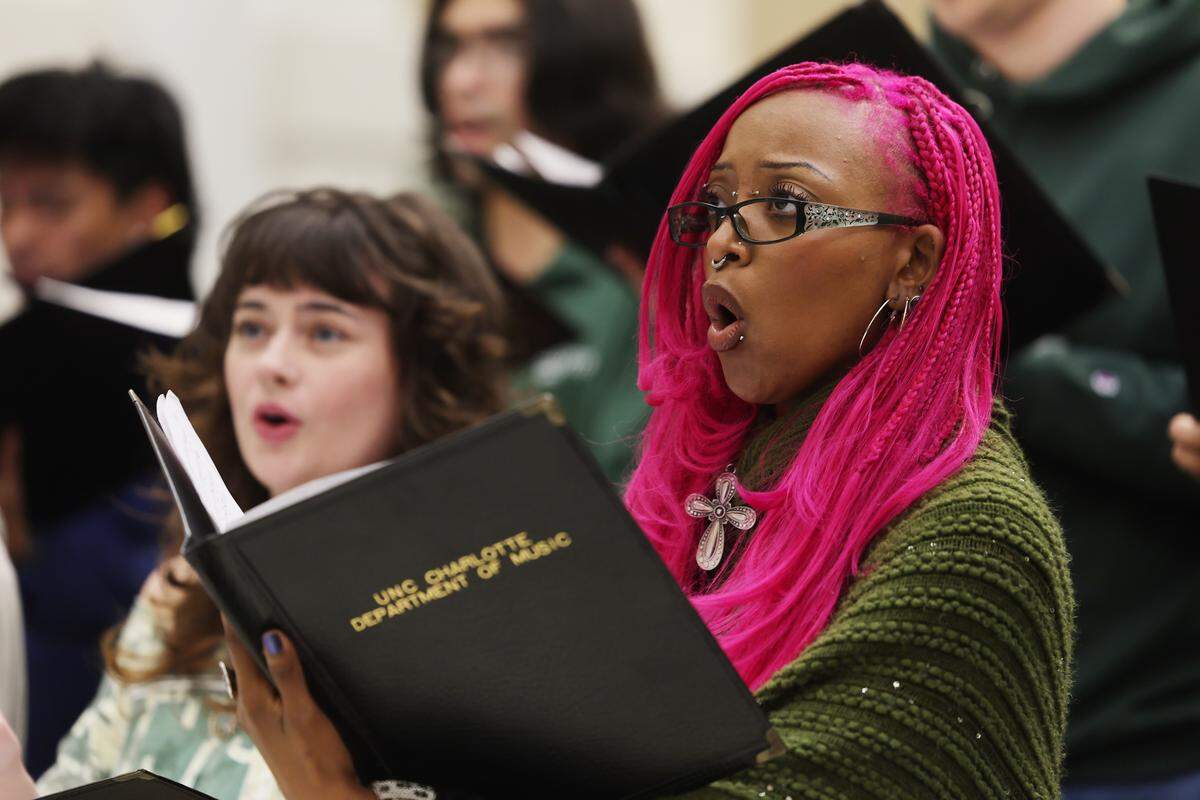 UNC Charlotte student Reem Nour rehearses on campus with the University Chorale. The group will be performing songs in Yiddish and Russian related to the book “Partisan Song.”