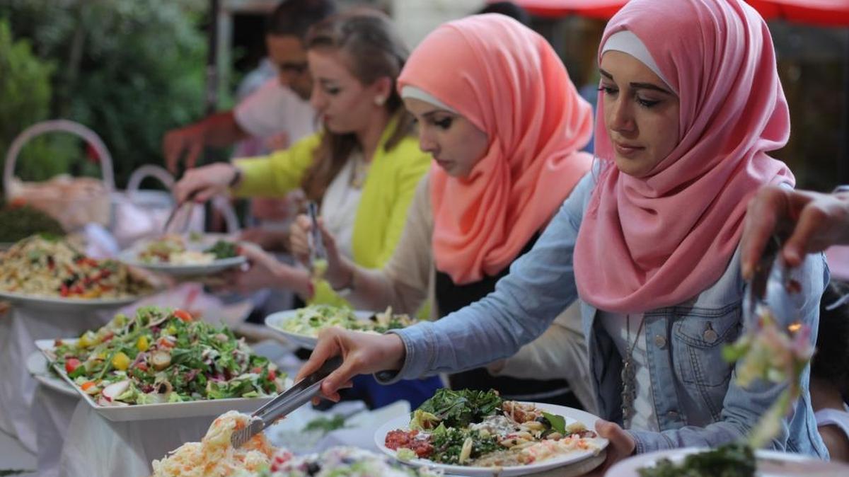 In Ramallah’s Orjuwan restaurant, guests pile bright salads on their plates to break the Ramadan fast with the Iftar meal on July 9, 2015.