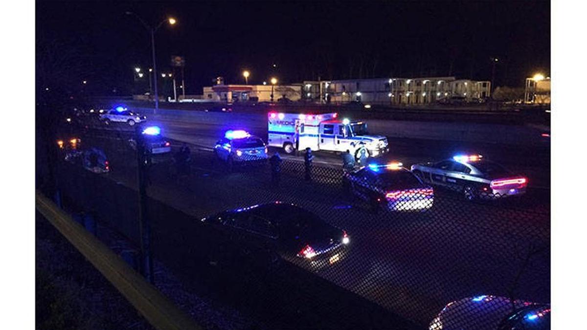 Police respond to the scene on Interstate 85 where a body was found Wednesday night.