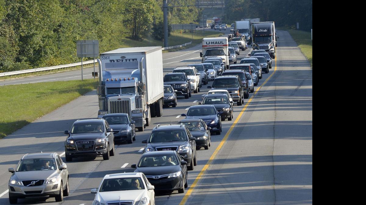 
 I-77 north bound traffic slowly advances at a crawl during the 5:00 PM commute on Oct. 02,2014, photo taken from the Gilead Road bridge at exit 23 in Huntersville. 
