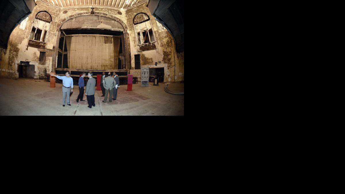 
FILE PHOTO, October 2012: City of Charlotte Special Projects Manager Robert Drayton (left) points out details as City Council members and other city officials took a tour of the old Carolina Theatre.
