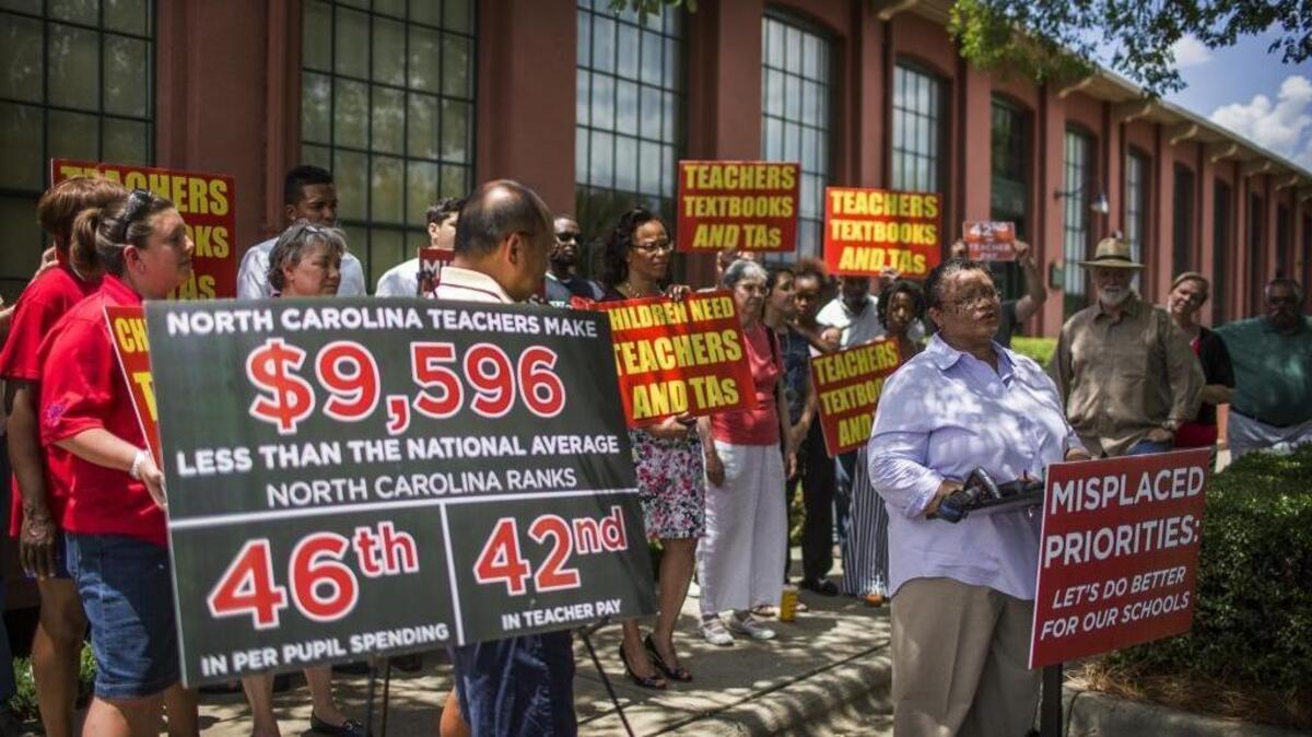 CMAE president Erlene Lyde talks to the press about the current state of education in North Carolina schools during an education rally organized by the nonprofit Aim Higher Now on June 14, 2015. The nonprofit rallied to bring attention to what parents and teachers describe as the state legislatures failure to give adequate priority to the schools.