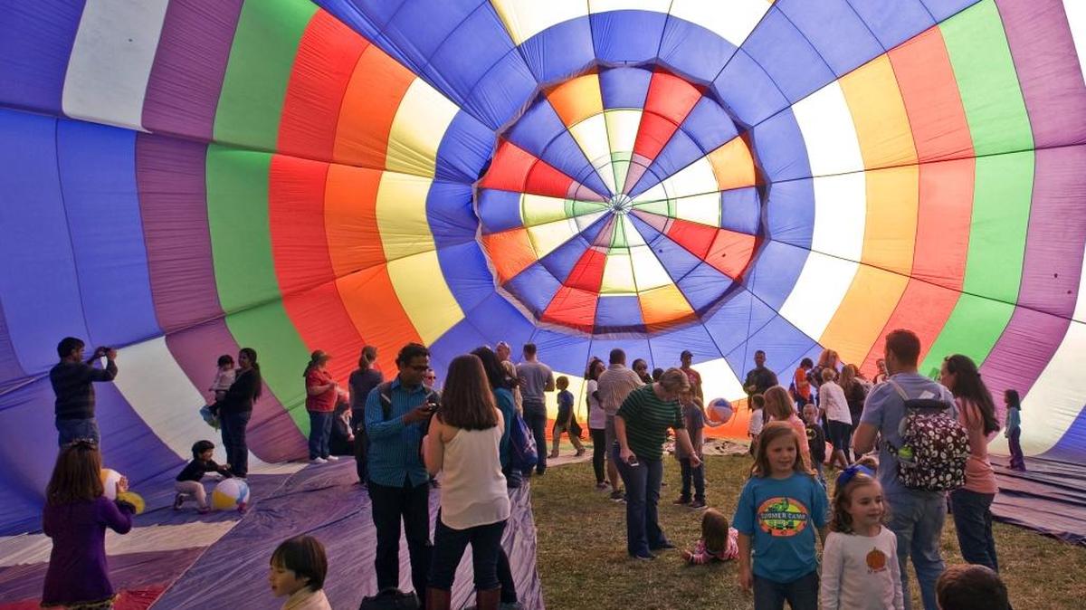 
Crowds played and took "selfies" inside a partially fan inflated balloon during the 42nd Annual Carolina BalloonFest at the Statesville Regional Airport on Saturday Oct. 17. For driving directions and ticket sales information for Sunday's events go to carolinaballoonfest.com. 
