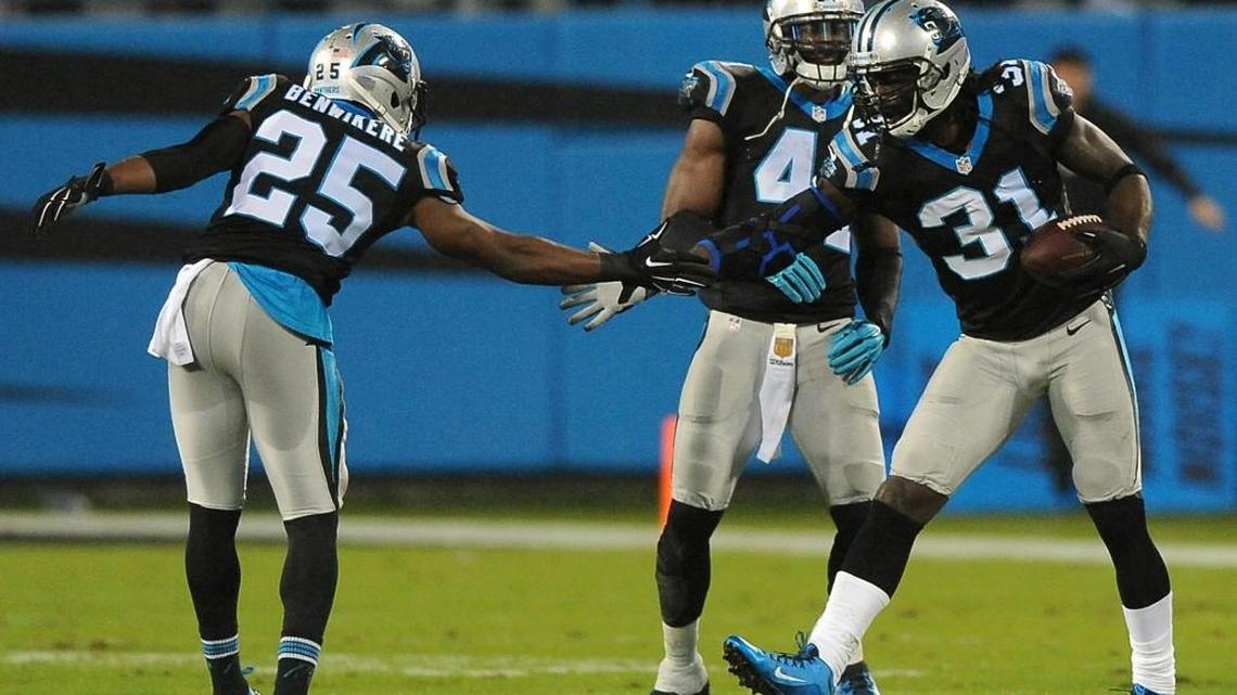 Carolina Panthers cornerback Charles Tillman, right, is congratulated by cornerback Bene Benwikere, left, after Tillman intercepted a pass meant for Indianapolis Colts tight end Dwayne Allen during first quarter action at Bank of America Stadium in Charlotte, NC on Nov. 2, 2015. The Panthers defeated the Colts 29-26.