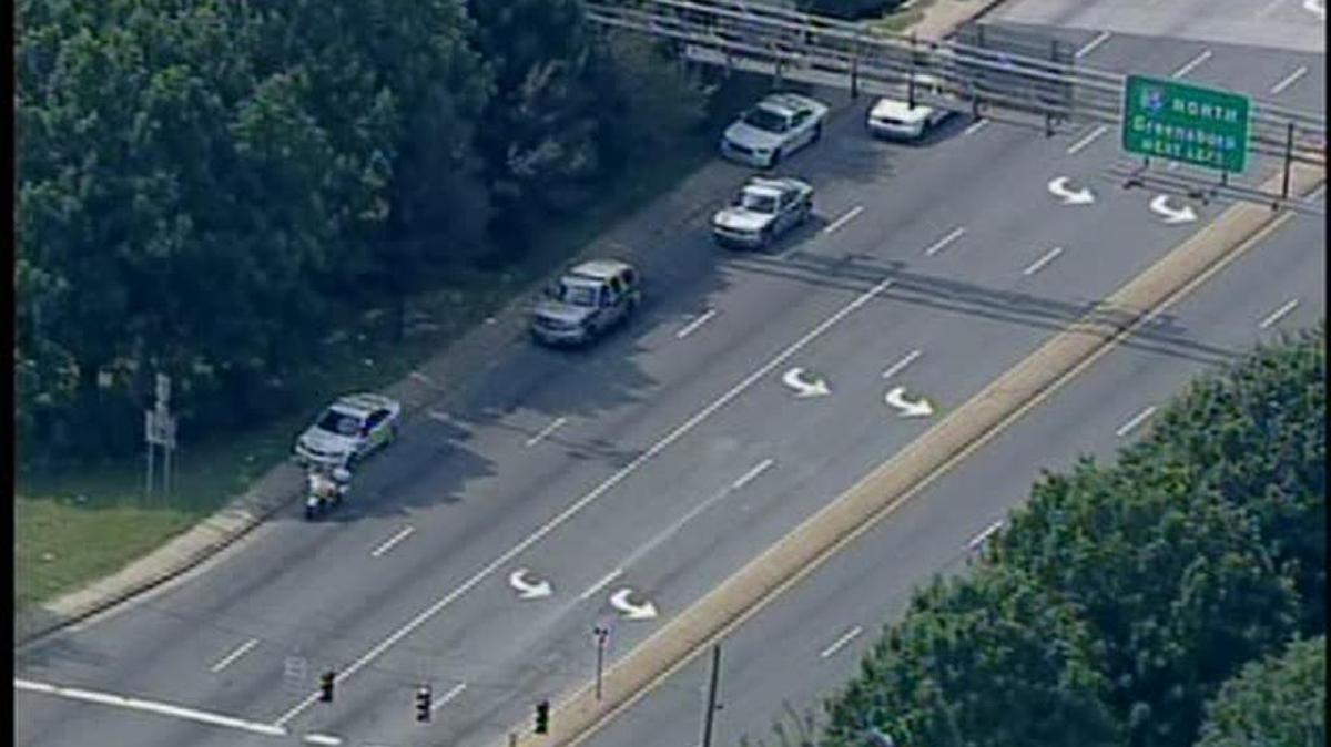 
Officers were searching a wooded area on Statesville Road Monday.
