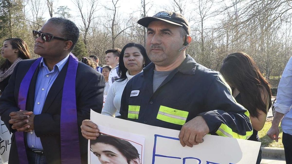 Moises Salmeron holds a picture of his nephew, Pedro Arturo Salmeron, during a prayer protest at the Department of Homeland Security on Feb. 29.
