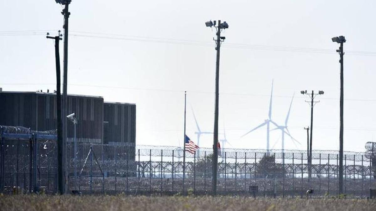 A flag at Pasquotank Correctional Institution in Elizabeth City flies at half-staff shortly after the deadly October escape attempt.