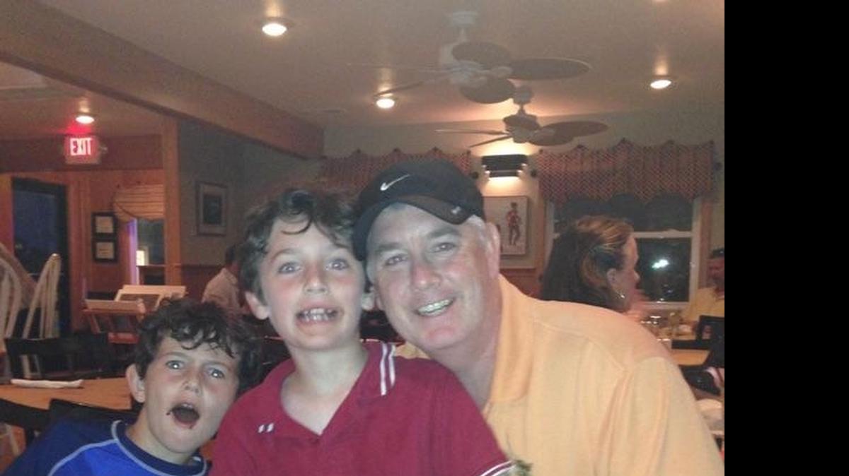 
Patrick Thornton holding his son Jack, with Sean Irvin, Jack's cousin, left.
