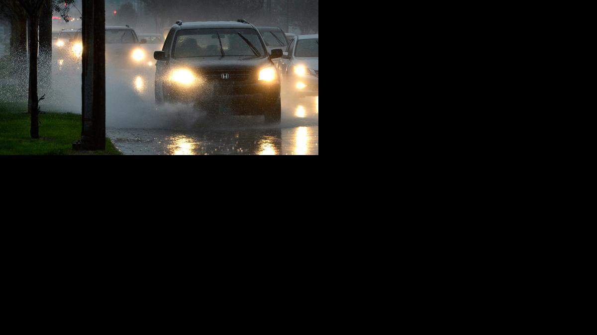 
Commuters encounter rain on their way along inbound Freedom Drive early Monday. 
