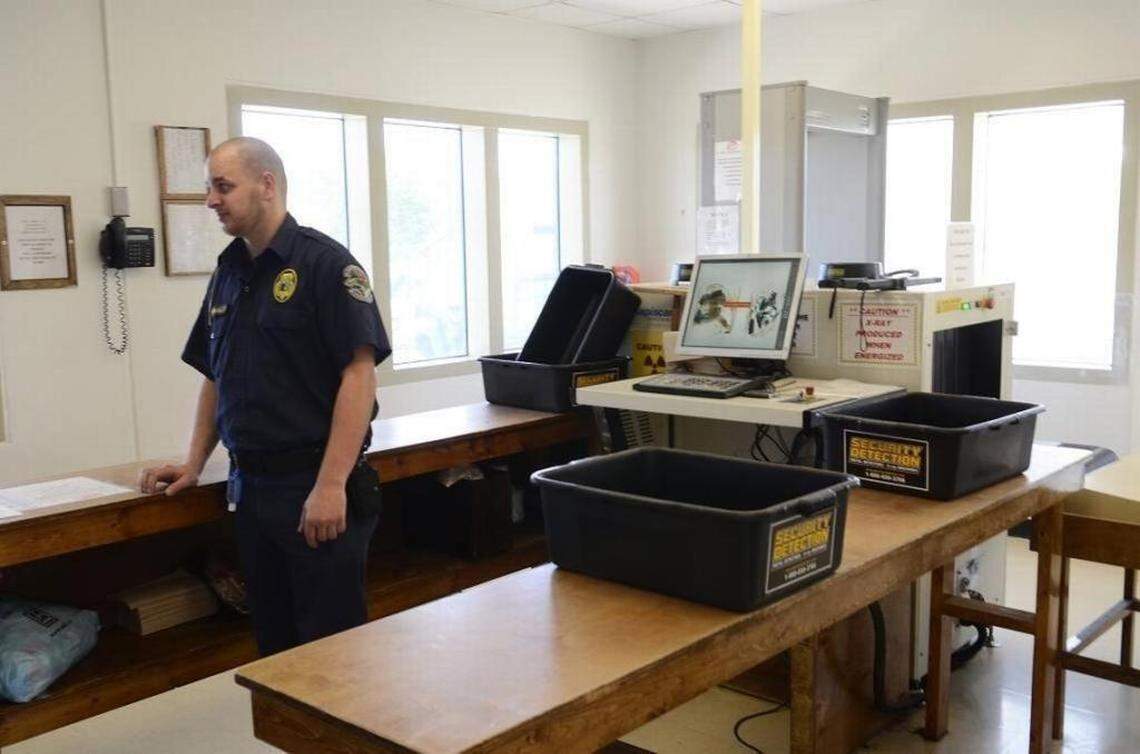 A correctional officer at Lanesboro Correctional Institution, in Polkton, works in the prison’s gatehouse, where employees report to work each day. Employees smuggle in most of the contraband that finds its way into North Carolina’s maximum-security prisons, the Observer found.