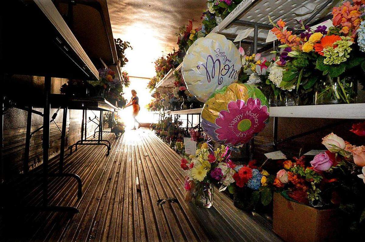 A large refrigerated truck brought into the back of The Blossom Shop on Mother's Day for extra cooler storage (the store's regular cooler storage room isn't large enough) is filled with completed Mother's Day arrangements. The Blossom Shop on Park Road is extremely busy on Friday and Saturday with flower orders for Mother's Day. "It's one of our two busiest days, along with Valentine's Day," said shop owner Ted Todd. 