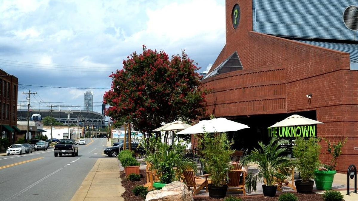 The Unknown Brewing Co., right, is the closest brewery to the Bank of America Stadium.