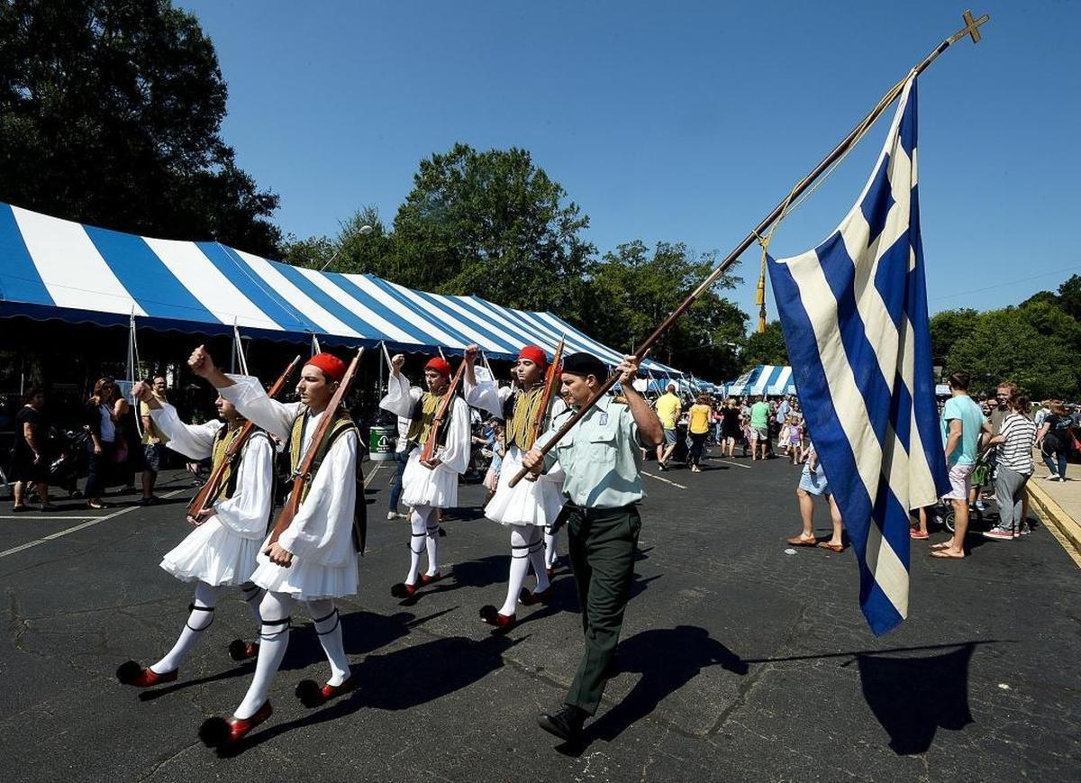 The opening ceremony at the annual Yiasou Greek Festival Saturday at Holy Trinity Greek Orthodox Church includes the traditional changing of the guard. Started in 1978, the festival has become one of Charlotte's largest cultural events, featuring Greek food, live Greek music and folk dancing, vendors and many other forms of entertainment.