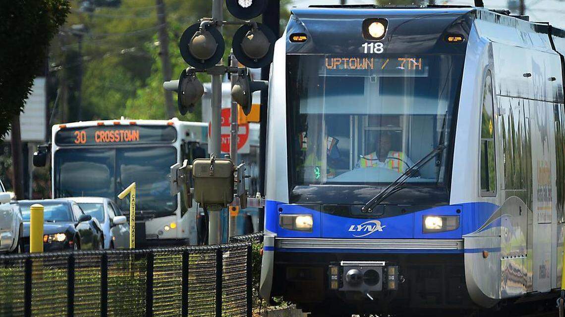 
A CATS transit bus and LYNX light-rail train travel along South Blvd. Tuesday, Sept. 1, 2015. Transit ridership in Charlotte has declined for much of this year, possibly due to lower gas prices.
