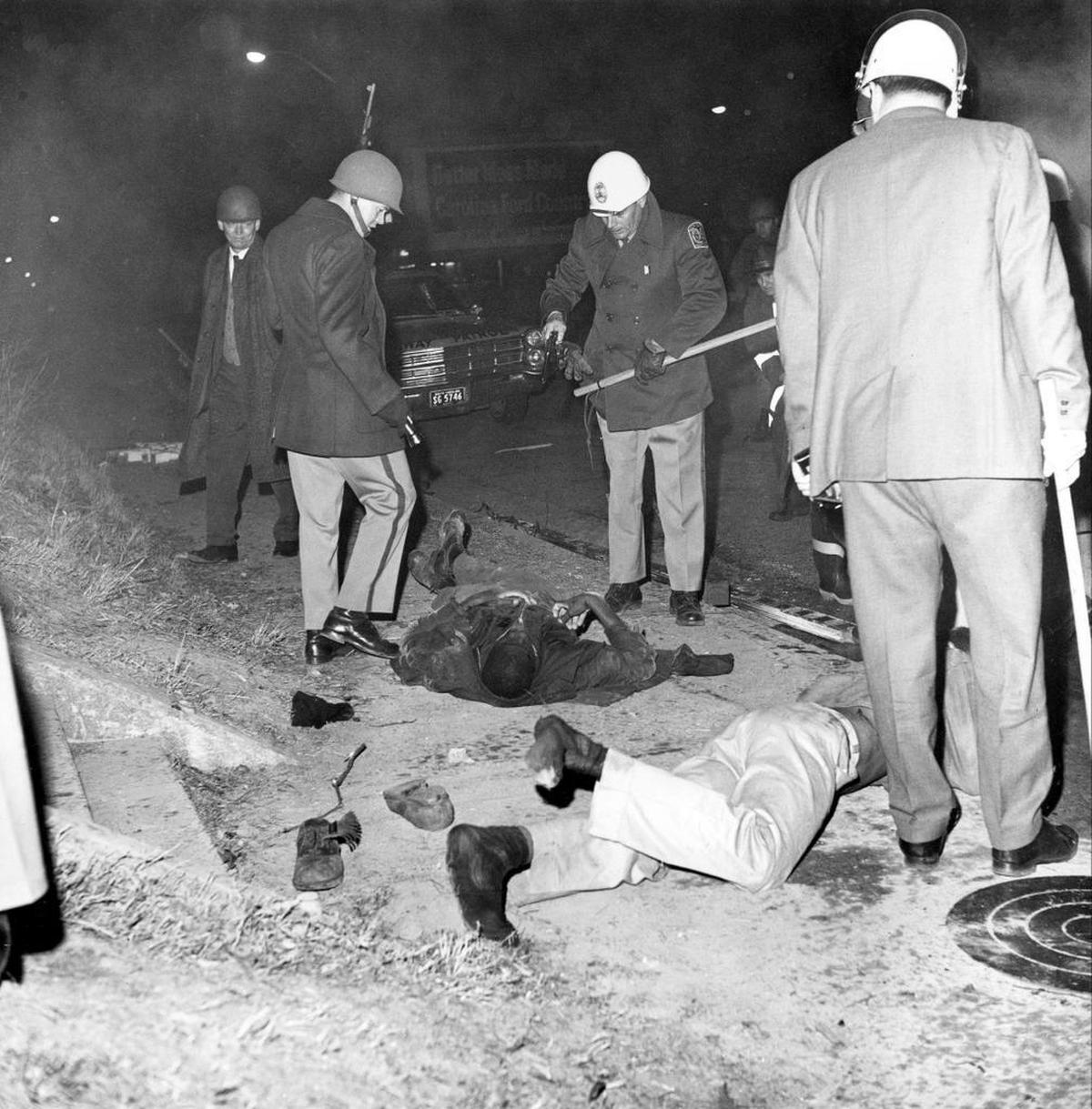 Two demonstrators killed in the Orangeburg Massacre lie on the ground at the edge of South Carolina State in Orangeburg, S.C., on Feb. 8, 1968.