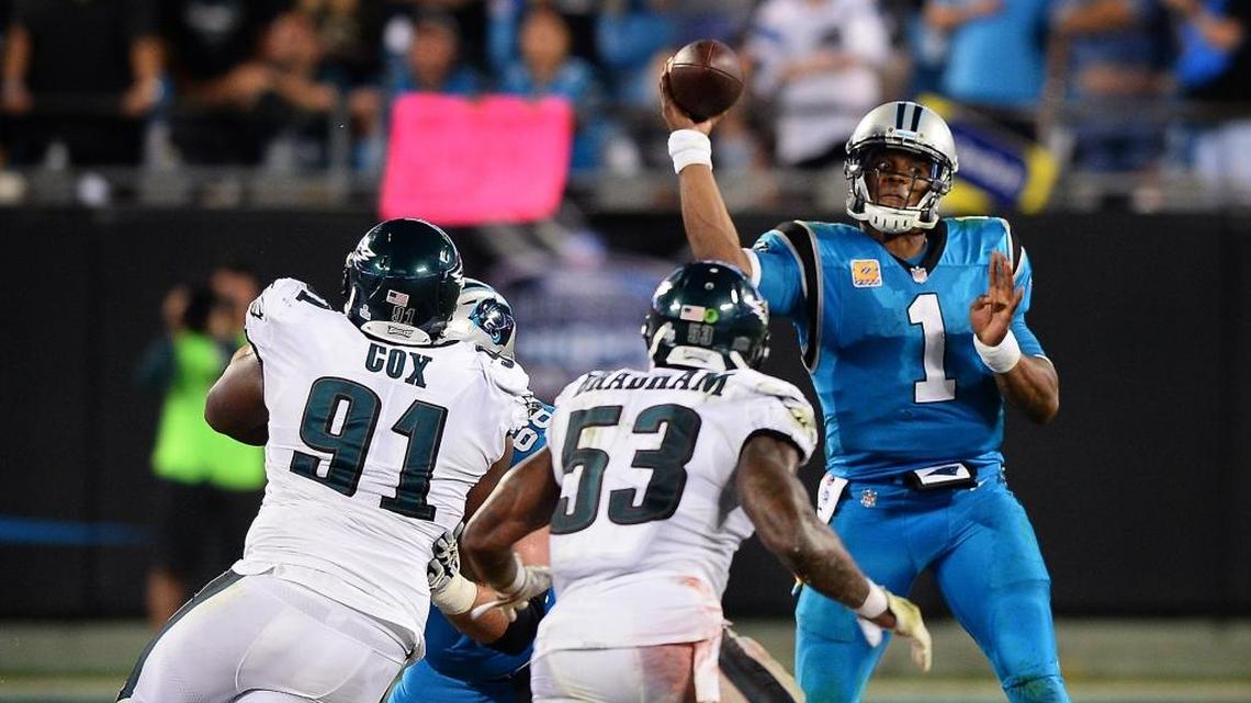 Carolina Panthers quarterback Cam Newton passes to a receiver as Philadelphia Eagles defensive tackle Fletcher Cox and linebacker Nigel Bradham rush during fourth quarter action on Oct. 12, 2017, at Bank of America Stadium. The Panthers lost to the Eagles 28-23. Cox has settled a lawsuit in which a North Carolina man claimed the player seduced his wife and broke up their marriage, according to court records in Mecklenburg County, North Carolina.
