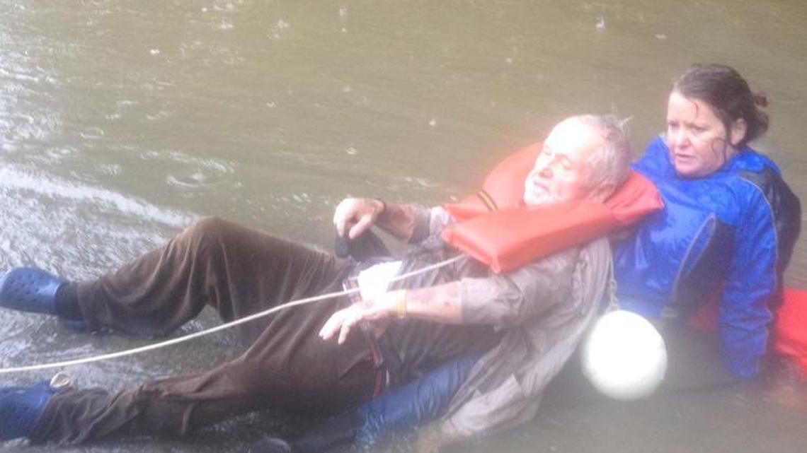 
Julie Hall holds the man her husband and family helped save in flooding north of Columbia Sunday.
