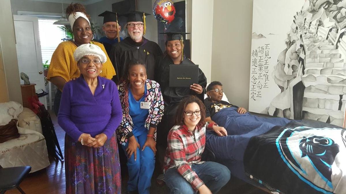Front row from left, Queen Whaley, hospice nurse Melisha Smith, Sloane Whaley’s godsister Shannon Lee, Reba Whaley. Back row, hospice social worker Doreatha Mays-Benton, ASU Vice Provost Mike Mayfield, art department Chair Clifton Meador, Sloane Whaley.