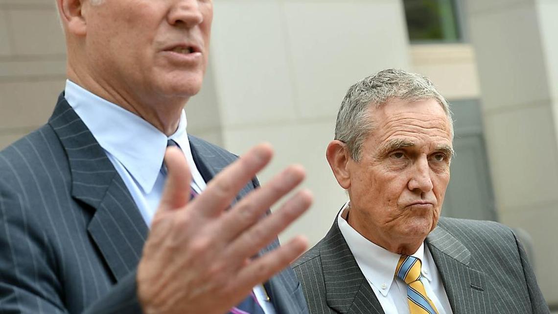 
Attorney Richard Vinroot, left, and former Aviation Director Jerry Orr speak to the media following a hearing at the Mecklenburg County Courthouse on August 1, 2013. A judge had blocked the transfer of control of Charlotte Douglas International Airport pending a decision from the FAA about the change. 
