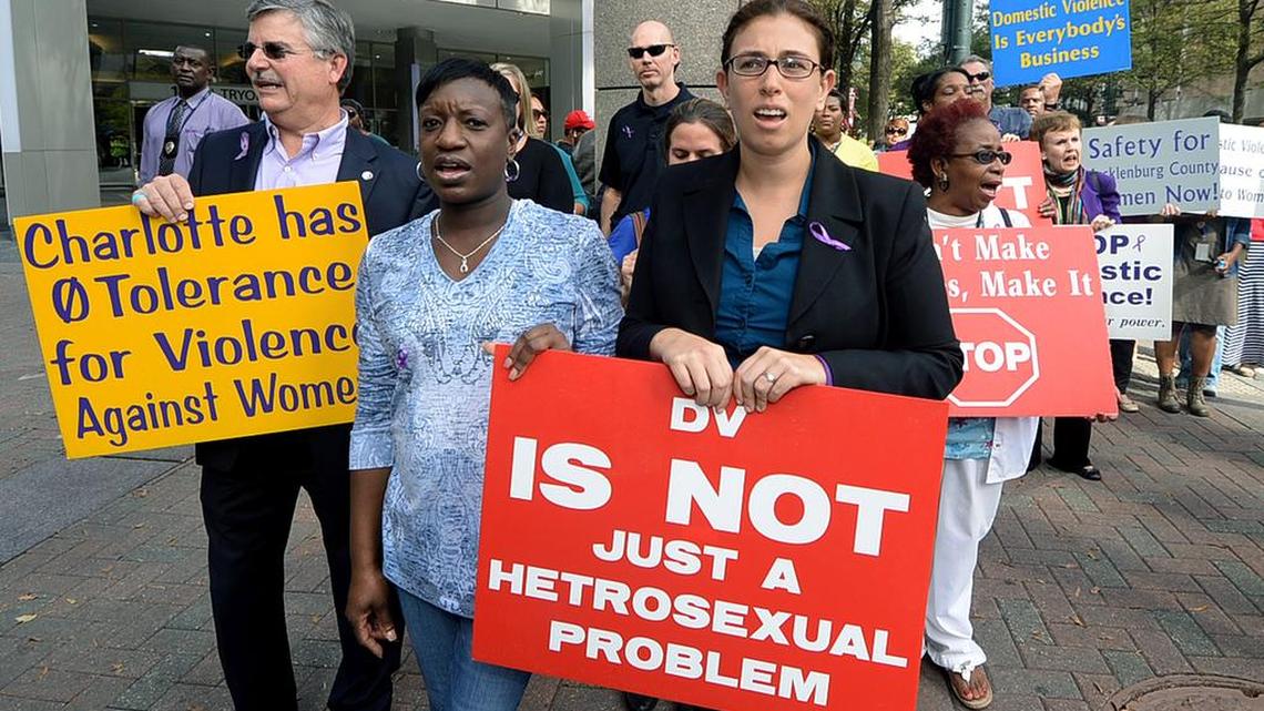 In this 2015 photo, marchers take part in a march against domestic violence.
