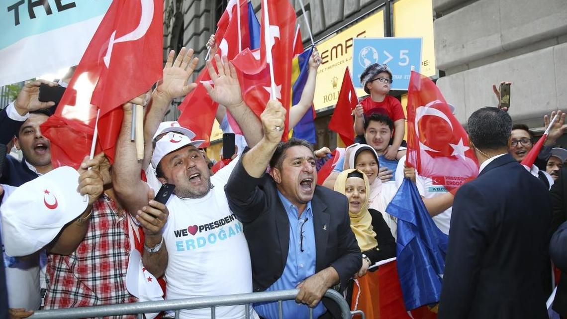 In this photo taken on Sunday and made available on Monday, supporters of Turkey’s President Recep Tayyip Erdogan cheer as he arrives at his hotel in New York. Erdogan is in New York for the United Nations General Assembly.
