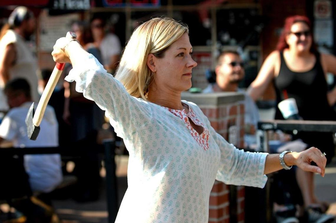 Michelle Jandebeur displays her form while throwing an axe. Jandebeur was throwing the axe for her son, Caden who is 11 and too young to participate.