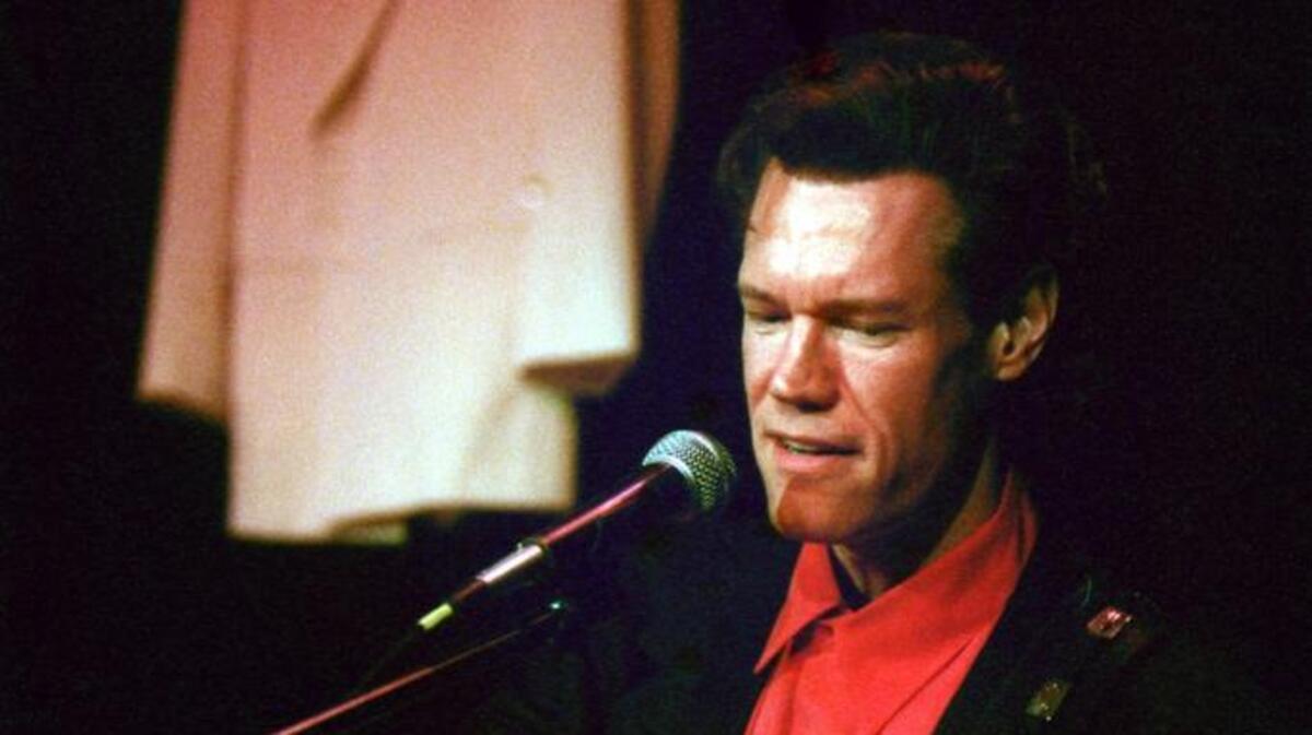 Country music star Randy Travis performs a set at his official induction into the North Carolina Hall of Fame at Spirit Square in May of 1999.