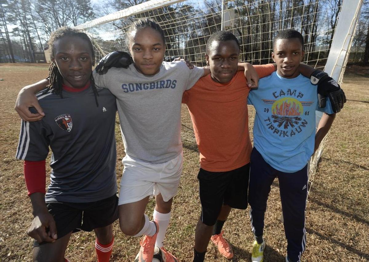Deron Huggins, (left), Jah'Qwel Williams, Tyree Watson, and Ryan Chambers in 2014 before heading to play in a street soccer tournament in Brazil. All four are in college now.