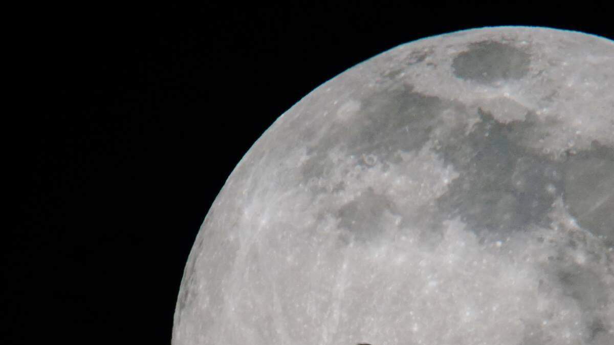 The photographer used a telescope and held his Sony dslr camera to the telescope's eyepiece to get this great photo of the moon.
