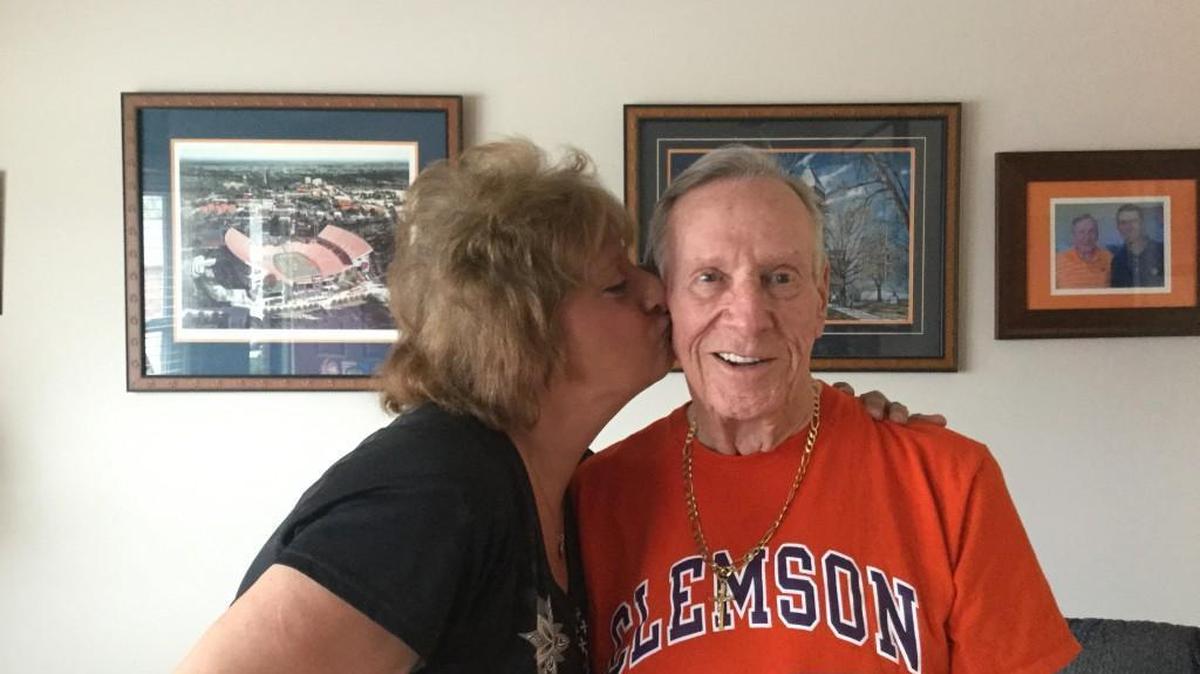 Veronica Erwin gives a friendly kiss to Charlie Funderburke. He made sure she has a seat to watch Winthrop play in this weeks conference tournament.