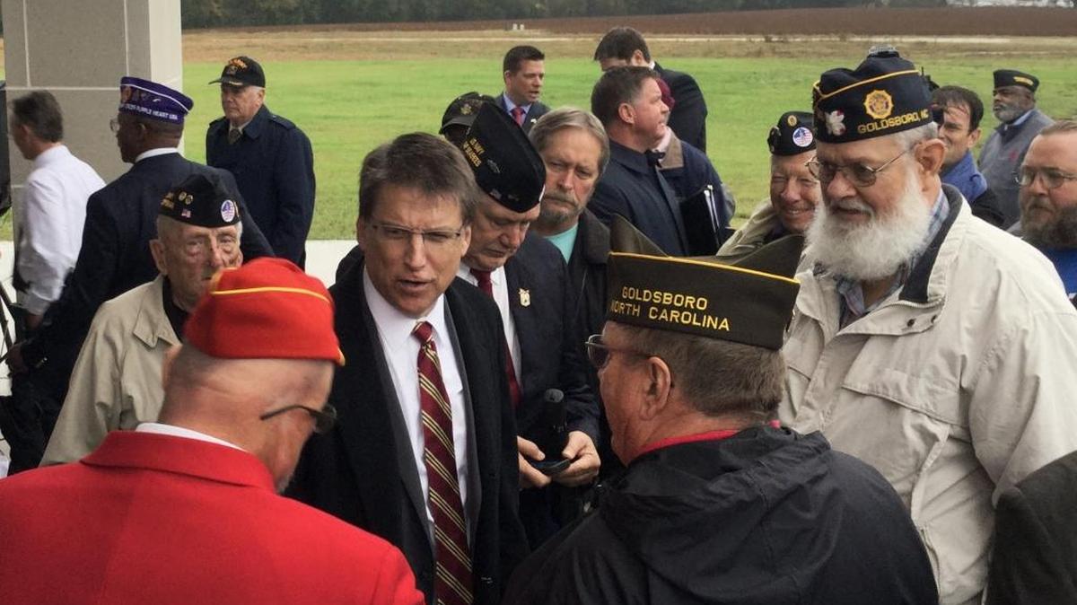 Gov. Pat McCrory, center, greets a group of veterans after dedication of the state’s newest veterans cemetery in Goldsboro in November.