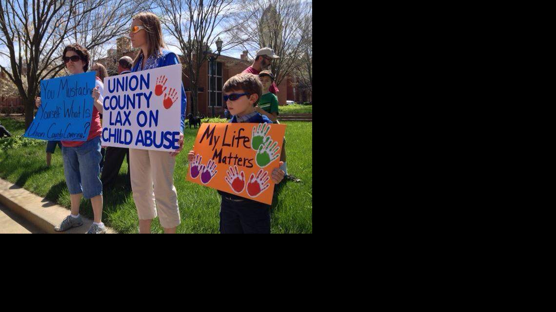 
Lea Boyle and son Brendon, 6, were among about 100 protesters Saturday in Monroe who criticized a plea deal for Wanda Sue Larson, a former child protective services supervisor in Union County. Larson was sentenced to a maximum 17 months and likely will be freed this week after spending 16
1/2 months in jail for her part in a stunning child abuse case.
