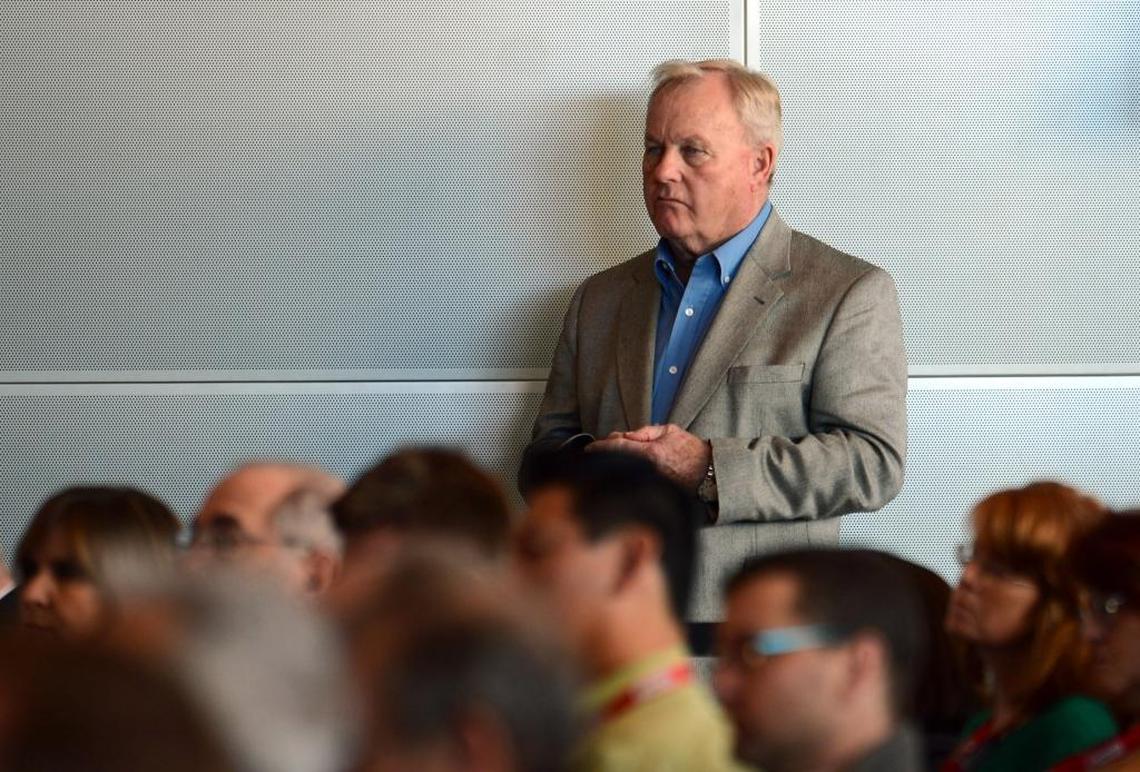 Former President and General Manager of Charlotte Motor Speedway H.A. “Humpy” Wheeler listens to American CEO and Chairman of NASCAR Brian France during the Sprint NASCAR Media Tour stop at the NASCAR Hall of Fame in Charlotte on January 22, 2013.