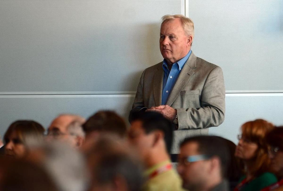 Former President and General Manager of Charlotte Motor Speedway H.A. “Humpy” Wheeler listens to American CEO and Chairman of NASCAR Brian France during the Sprint NASCAR Media Tour stop at the NASCAR Hall of Fame in Charlotte on January 22, 2013.
