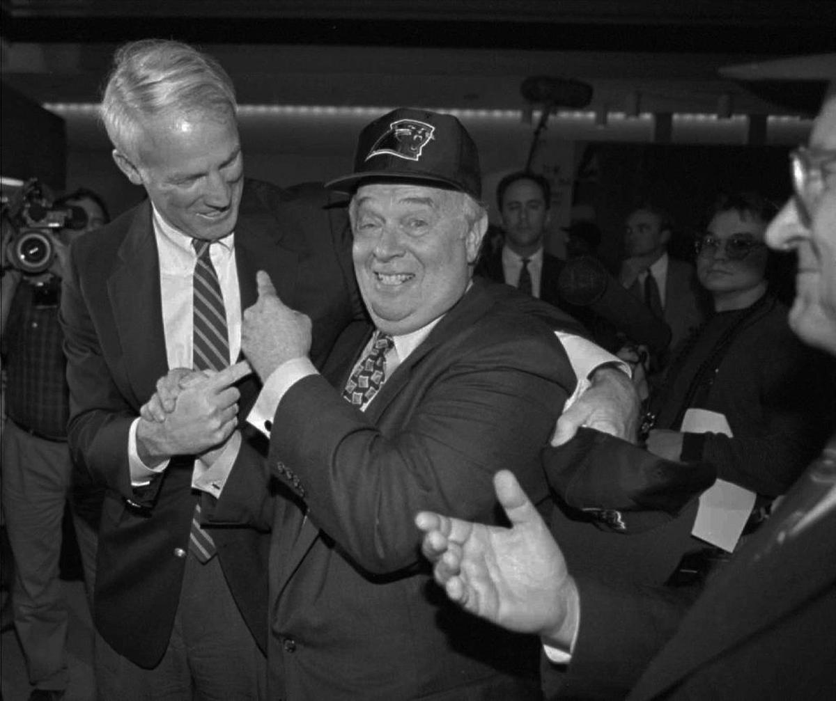Max Muhleman (right) celebrates with Charlotte mayor Richard Vinroot in Chicago shortly after it was announced that Charlotte would get an NFL team in October 1993.