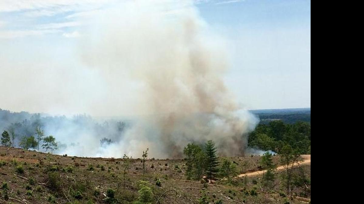 
Local and N.C. Forest Service fire crews with brush trucks continued to attack a fire Tuesday across rugged terrain on Bakers Mountain in Catawba County.

