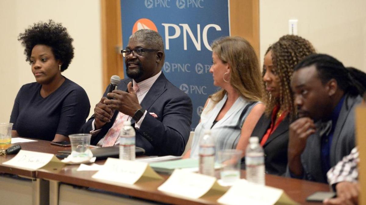 Willie Ratchford, executive director of the Charlotte-Mecklenburg Community Relations Committee, addresses a conference at The Mint Museum in Charlotte.