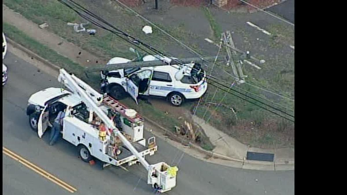 
Police SUV with utility pole on top.
