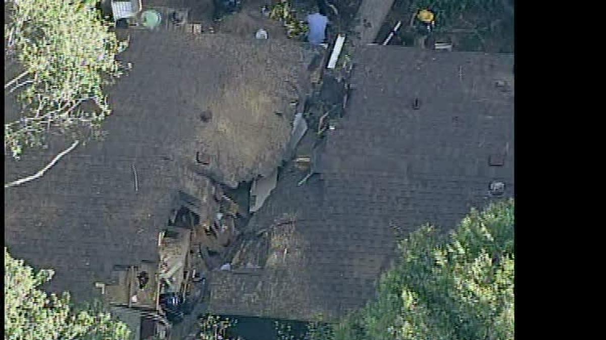 
A tree sliced through a house in Gastonia Friday
