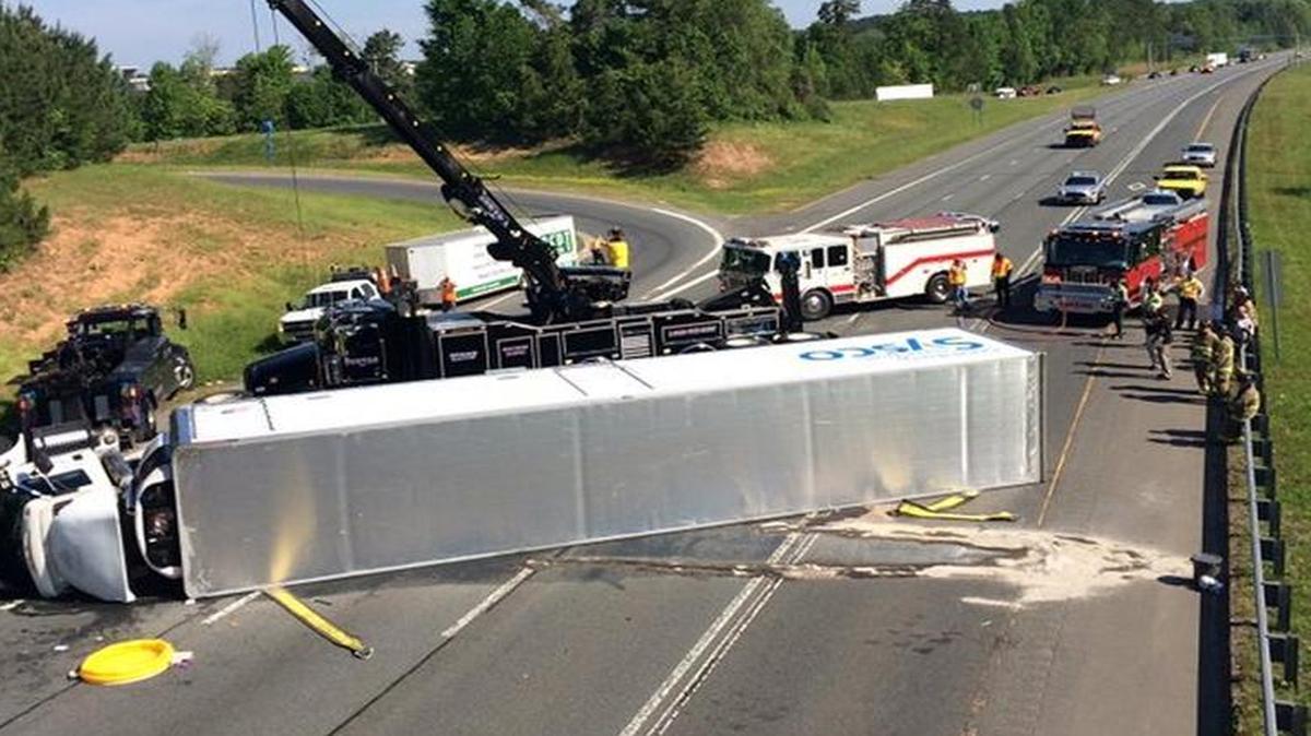 A tractor trailer overturned on Interstate 77 south Monday, blocking rush-hour traffic.