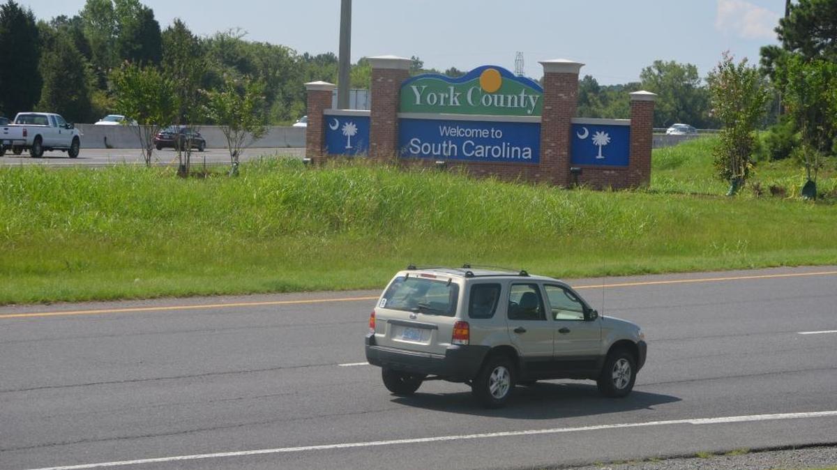 A sign welcomes motorists to York County at the Carowinds Boulevard exit off Interstate 77.
